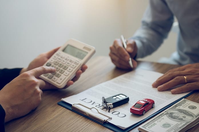 Finance manager of the car showroom is calculating the cost of reserving a new car